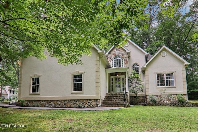 317 Fallen Oak Cir, Seymour, TN 37865 - traditional home featuring stucco siding, a front lawn, and stone siding
