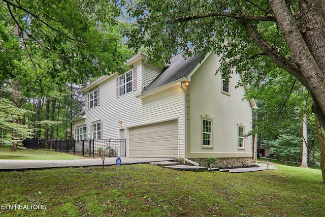 317 Fallen Oak Cir, Seymour, TN 37865 - view of side of property featuring an attached garage, concrete driveway, and a shingled roof