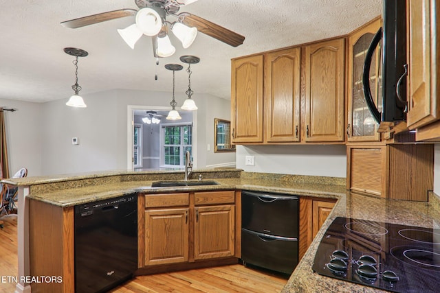 317 Fallen Oak Cir, Seymour, TN 37865 - kitchen with black appliances, brown cabinets, a peninsula, and ceiling fan