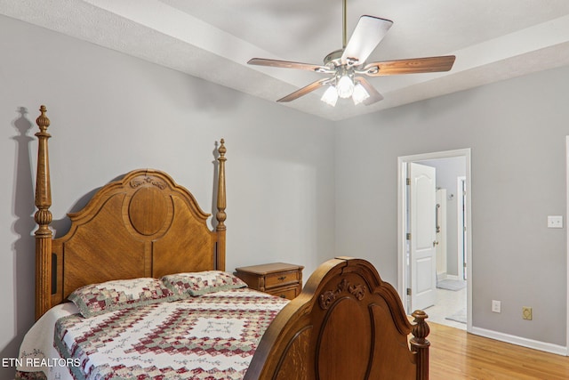 317 Fallen Oak Cir, Seymour, TN 37865 - bedroom featuring light wood-style floors, ensuite bathroom, and a ceiling fan