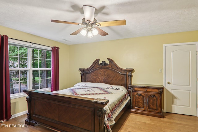 317 Fallen Oak Cir, Seymour, TN 37865 - bedroom with wood finished floors and ceiling fan