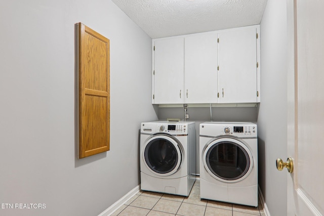 317 Fallen Oak Cir, Seymour, TN 37865 - washroom with cabinet space, washer and dryer, light tile patterned floors, and a textured ceiling