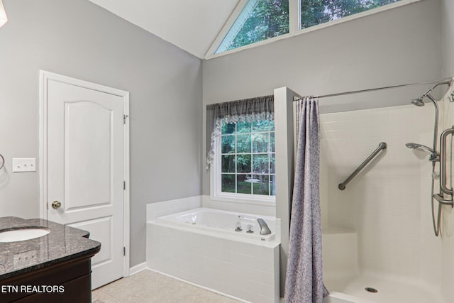 317 Fallen Oak Cir, Seymour, TN 37865 - bathroom with a bath, tile patterned flooring, tiled shower, healthy amount of natural light, and high vaulted ceiling