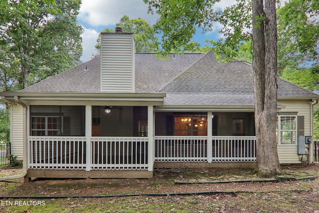 317 Fallen Oak Cir, Seymour, TN 37865 - view of front of house featuring roof with shingles, a sunroom, and a chimney