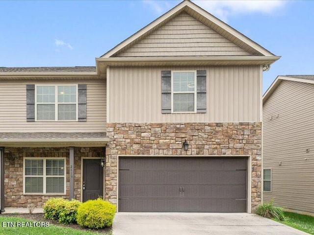 2415 Flannery Way, Powell, TN 37849 - view of front of home with stone siding, concrete driveway, and an attached garage