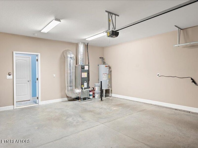 2415 Flannery Way, Powell, TN 37849 - garage with a garage door opener, electric water heater, and heating unit
