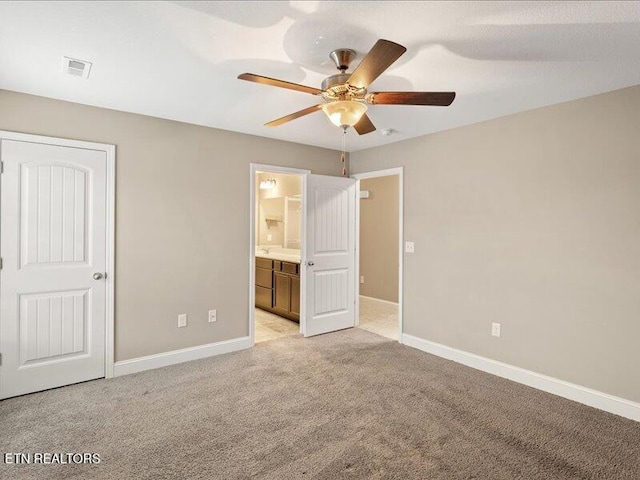 2415 Flannery Way, Powell, TN 37849 - unfurnished bedroom with light colored carpet, ensuite bathroom, and ceiling fan