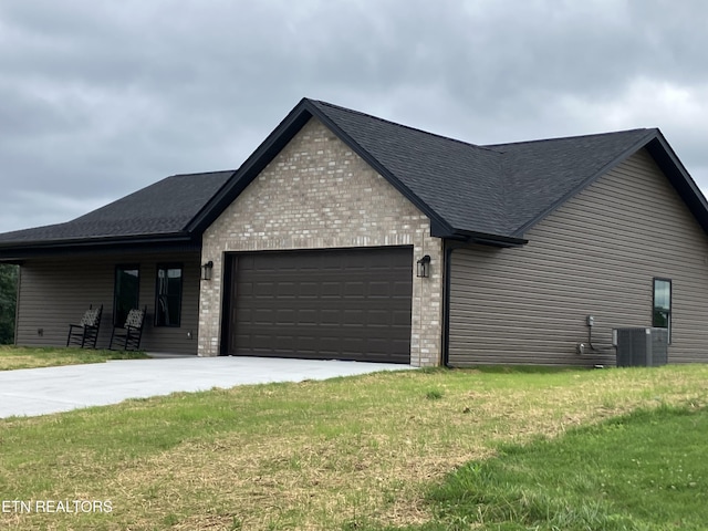 180 Sparks Landing Rd, Maynardville, TN 37807 - view of front of home featuring brick siding, an attached garage, a shingled roof, concrete driveway, and a front yard