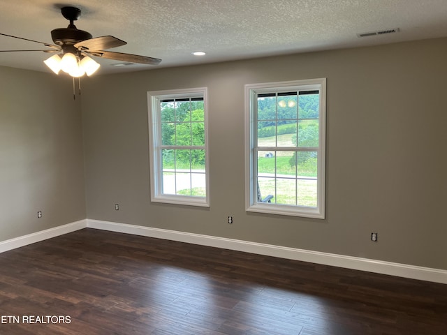 180 Sparks Landing Rd, Maynardville, TN 37807 - spare room featuring dark wood-style flooring, a textured ceiling, and a ceiling fan