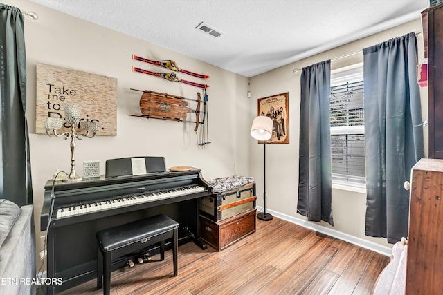 6718 Farmbrook Ln, Knoxville, TN 37918 - sitting room with wood finished floors and a textured ceiling