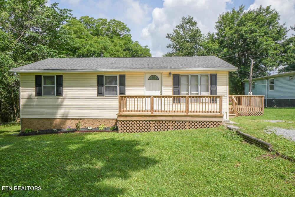 1803 Brook Ave, Maryville, TN 37801 - ranch-style home with a front lawn and a deck