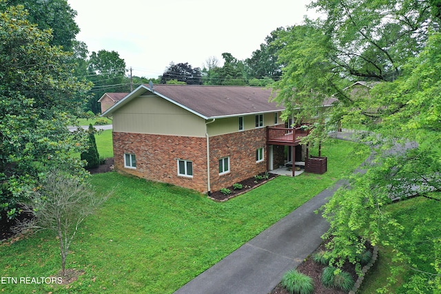 433 Clover Fork Dr, Knoxville, TN 37934 - view of property exterior with a yard, a deck, and brick siding