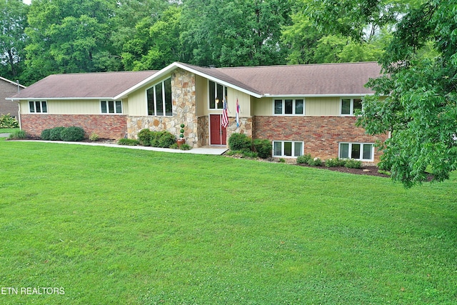 433 Clover Fork Dr, Knoxville, TN 37934 - view of front of home featuring a front yard, roof with shingles, stone siding, and brick siding