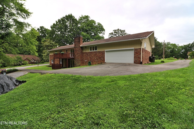 433 Clover Fork Dr, Knoxville, TN 37934 - ranch-style house with brick siding, driveway, a front lawn, and a chimney