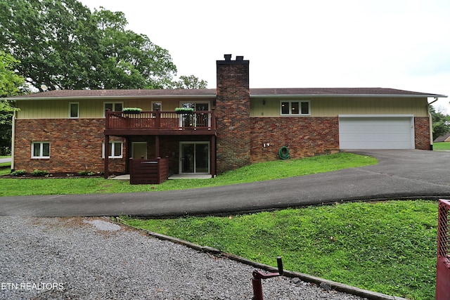 433 Clover Fork Dr, Knoxville, TN 37934 - view of front of property featuring brick siding, a chimney, asphalt driveway, and an attached garage
