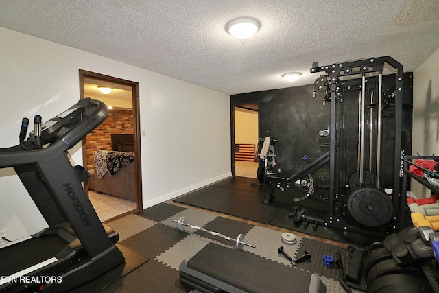 433 Clover Fork Dr, Knoxville, TN 37934 - exercise room with a textured ceiling