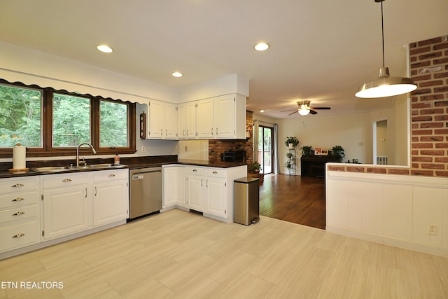 433 Clover Fork Dr, Knoxville, TN 37934 - kitchen with stainless steel dishwasher, dark countertops, open floor plan, white cabinetry, and a ceiling fan