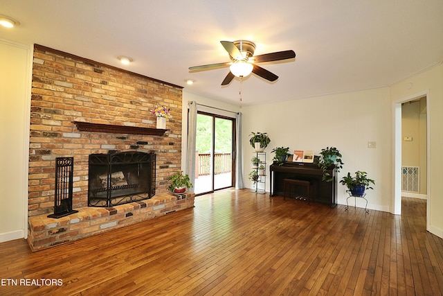 433 Clover Fork Dr, Knoxville, TN 37934 - living area featuring a ceiling fan, a brick fireplace, wood-type flooring, and crown molding