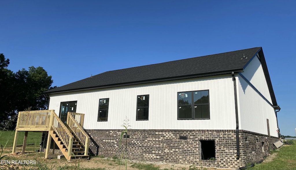 5817 Caldwell Rd, Loudon, TN 37774 - view of home's exterior with brick siding, stairway, and a deck