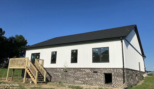 5817 Caldwell Rd, Loudon, TN 37774 - view of home's exterior with brick siding, stairway, and a deck