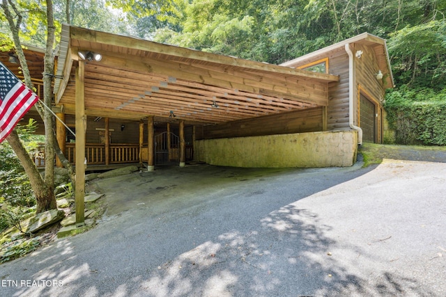 3014 N Clear Fork Rd, Sevierville, TN 37862 - view of car parking with an attached carport and asphalt driveway