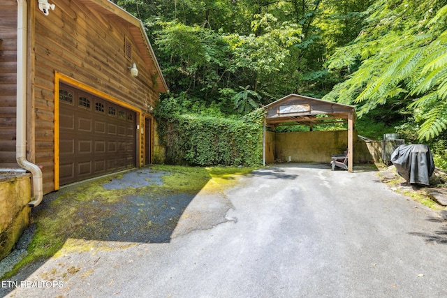 3014 N Clear Fork Rd, Sevierville, TN 37862 - garage featuring a detached carport and driveway