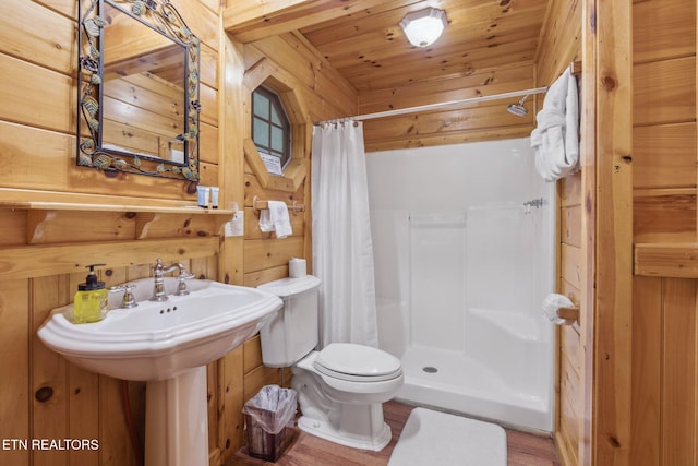 3014 N Clear Fork Rd, Sevierville, TN 37862 - full bath featuring wooden walls, wooden ceiling, a stall shower, and wood finished floors