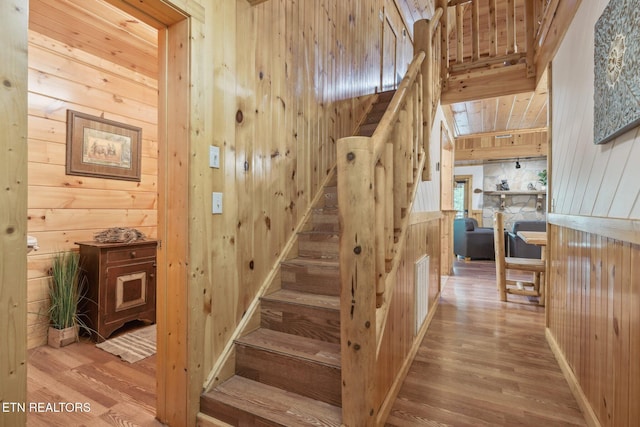 3014 N Clear Fork Rd, Sevierville, TN 37862 - staircase with wood walls and wood finished floors
