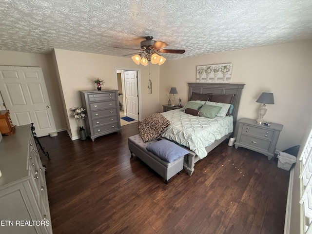 7808 Stone Garden Way, Powell, TN 37849 - bedroom with dark wood-style floors, a textured ceiling, and a ceiling fan