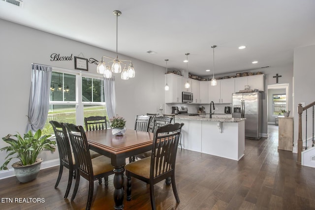 11944 Cordial Ln, Knoxville, TN 37932 - dining room with recessed lighting, dark wood finished floors, stairway, and a chandelier