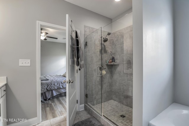 11944 Cordial Ln, Knoxville, TN 37932 - ensuite bathroom with a shower stall, vanity, a ceiling fan, a bath, and tile patterned flooring