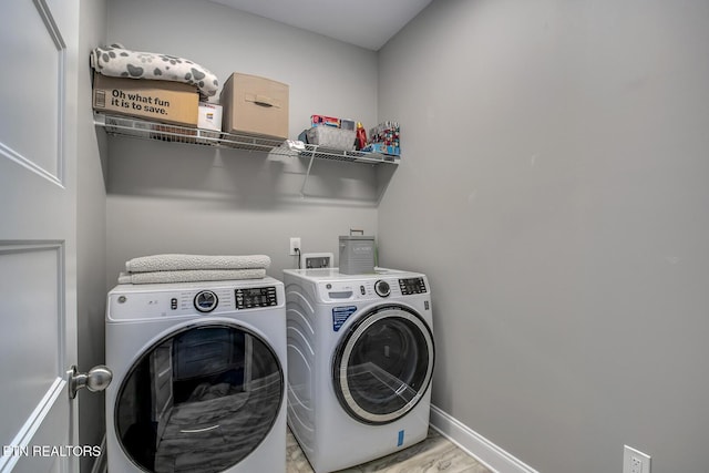 11944 Cordial Ln, Knoxville, TN 37932 - laundry room featuring separate washer and dryer and baseboards