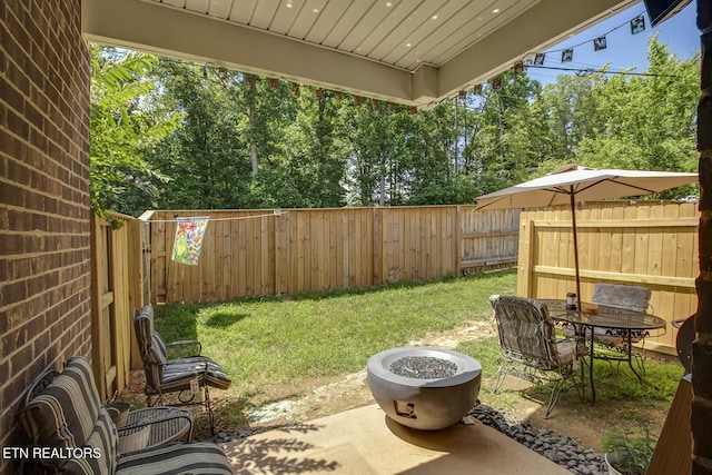 11944 Cordial Ln, Knoxville, TN 37932 - fenced backyard with a patio and an outdoor fire pit
