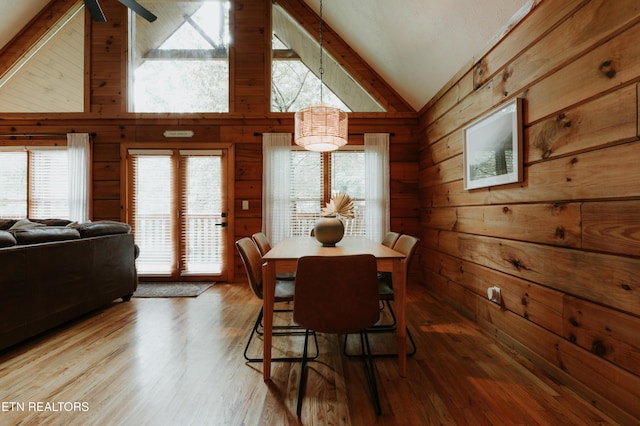 3653 Country Pines Way, Sevierville, TN 37876 - dining space featuring wooden walls, wood finished floors, high vaulted ceiling, and beamed ceiling