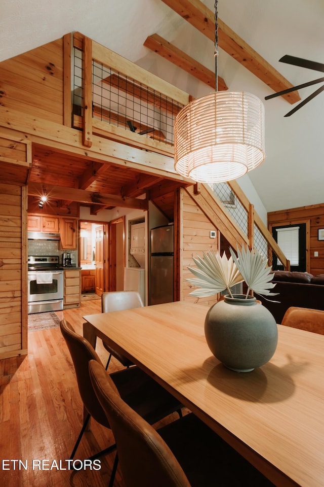 3653 Country Pines Way, Sevierville, TN 37876 - dining room featuring light wood-style floors and wooden walls