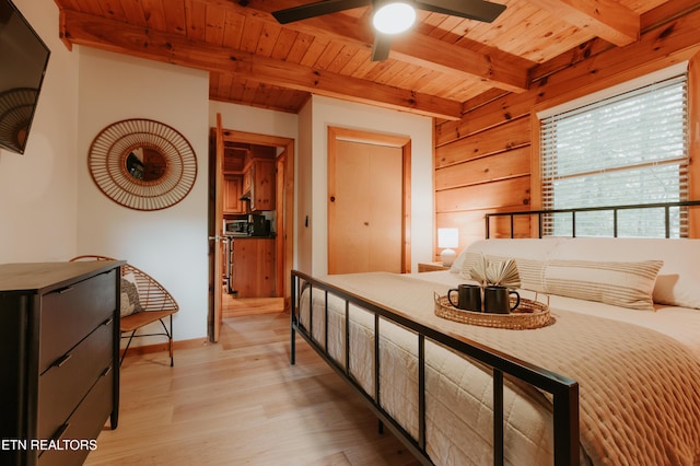 3653 Country Pines Way, Sevierville, TN 37876 - bedroom featuring a wooden ceiling with exposed beams, light wood-type flooring, and wood walls