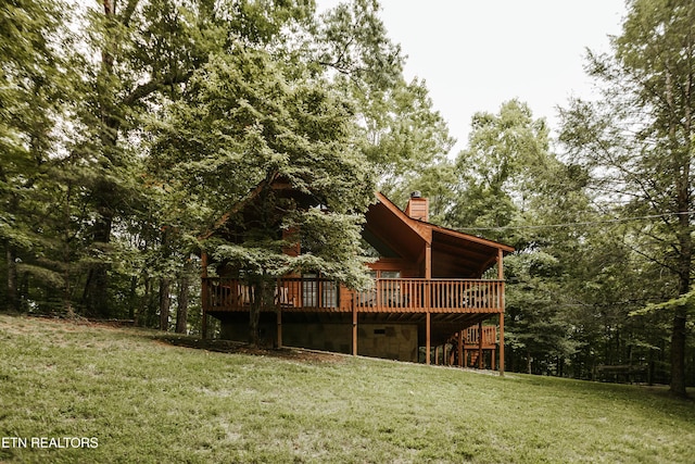 3653 Country Pines Way, Sevierville, TN 37876 - rear view of property featuring a chimney, a deck, and a lawn