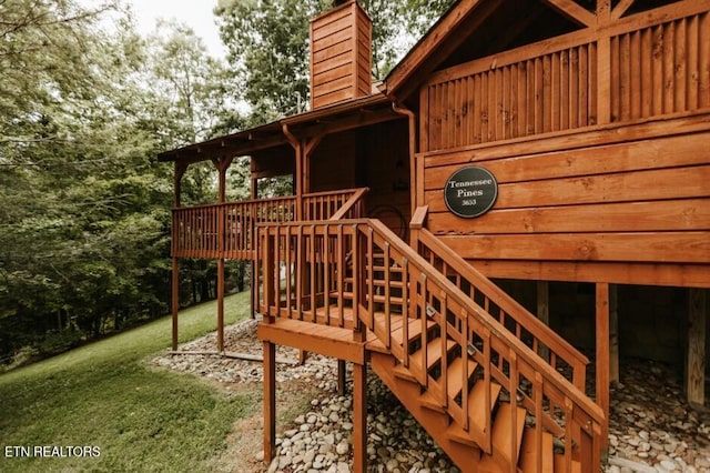 3653 Country Pines Way, Sevierville, TN 37876 - exterior space with stairway, a chimney, a yard, and a deck