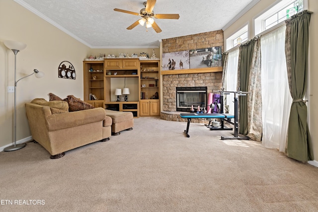 1914 Old Chilhowee Rd, Seymour, TN 37865 - living room with carpet flooring, a textured ceiling, a ceiling fan, a fireplace, and crown molding