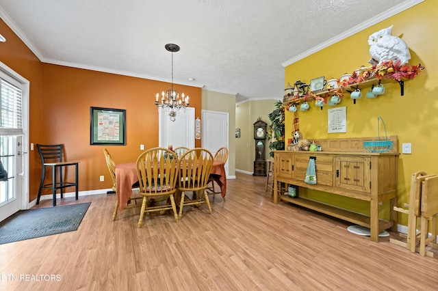 1914 Old Chilhowee Rd, Seymour, TN 37865 - dining area with a chandelier, wood finished floors, ornamental molding, and a textured ceiling
