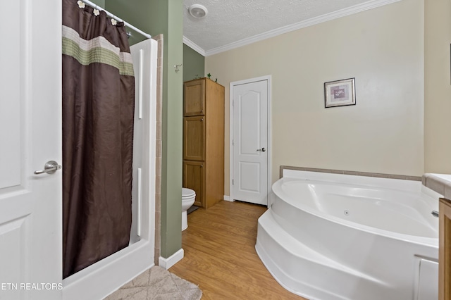 1914 Old Chilhowee Rd, Seymour, TN 37865 - bathroom with crown molding, a shower stall, a whirlpool tub, wood finished floors, and a textured ceiling