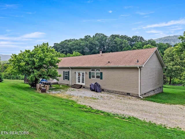 1914 Old Chilhowee Rd, Seymour, TN 37865 - rear view of property featuring crawl space, a lawn, french doors, entry steps, and a shingled roof