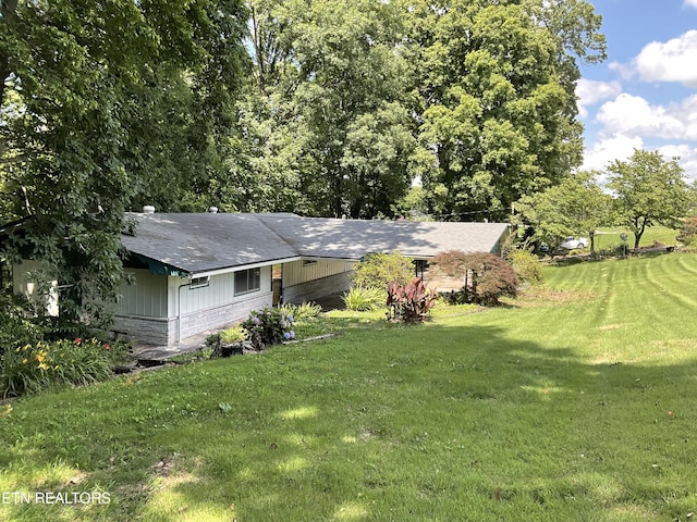 3505 Hackworth Rd, Knoxville, TN 37931 - view of front of home featuring a front lawn, a carport, and roof with shingles