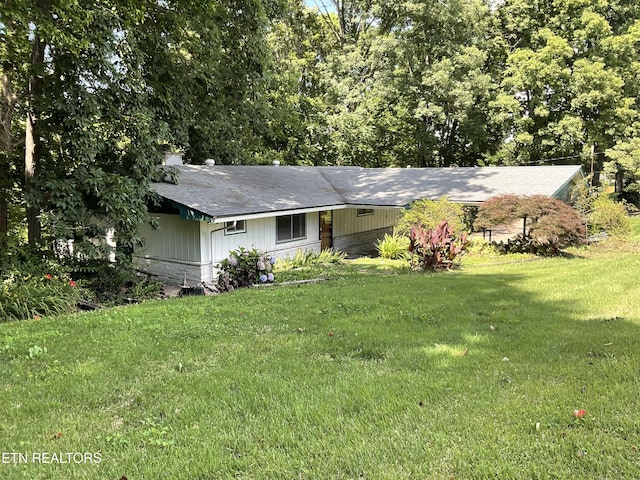 3505 Hackworth Rd, Knoxville, TN 37931 - view of front of home featuring a front lawn, an attached carport, and roof with shingles