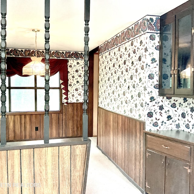 3505 Hackworth Rd, Knoxville, TN 37931 - unfurnished dining area with wood walls, wallpapered walls, and wainscoting
