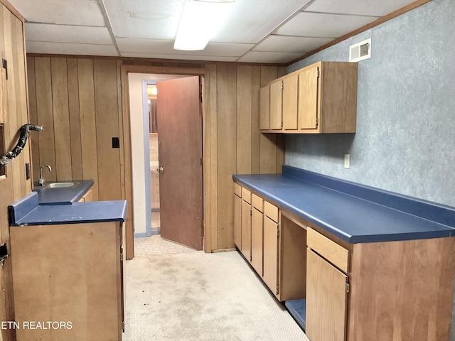 3505 Hackworth Rd, Knoxville, TN 37931 - kitchen with dark countertops, wooden walls, light carpet, and a paneled ceiling