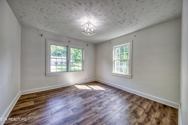 313 Edgewood Cir, Clinton, TN 37716 - spare room with a chandelier and wood-type flooring