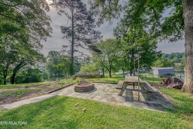 313 Edgewood Cir, Clinton, TN 37716 - view of yard featuring an outdoor fire pit and view of wooded area