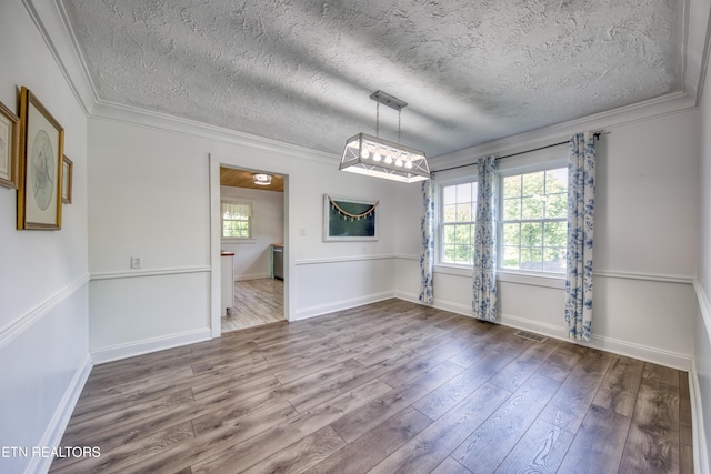 313 Edgewood Cir, Clinton, TN 37716 - unfurnished room with ornamental molding, wood finished floors, and a textured ceiling