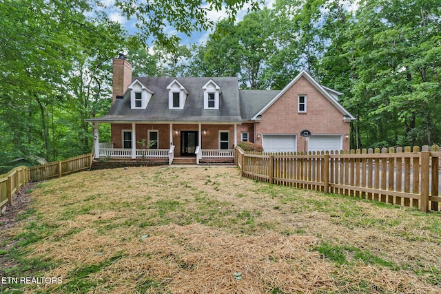 110 Lakecrest Ln, Oak Ridge, TN 37830 - cape cod home featuring brick siding, covered porch, a fenced backyard, and a chimney